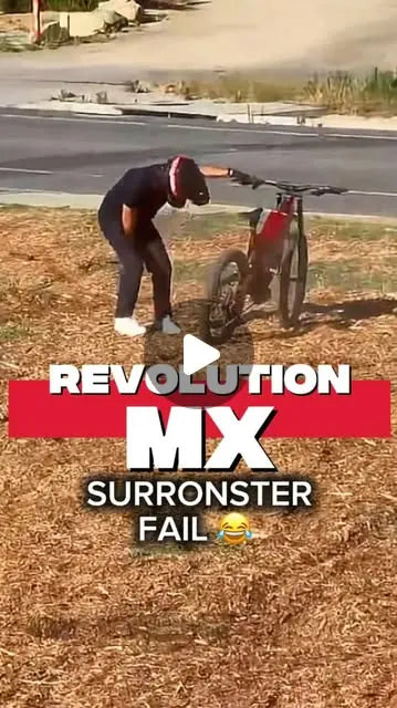 Rider catching big air on the HPC Revolution MX downhill electric mountain bike at a desert track