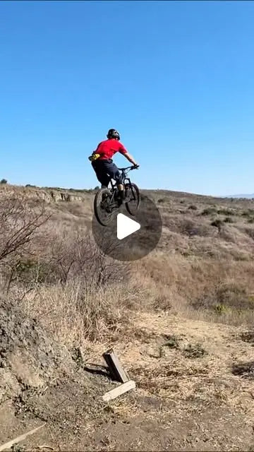 HPC Trailblazer enduro e-bike catching air, showcasing 160mm front suspension travel